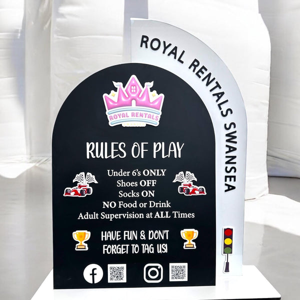 Acrylic play rules sign displaying soft play safety guidelines with QR codes