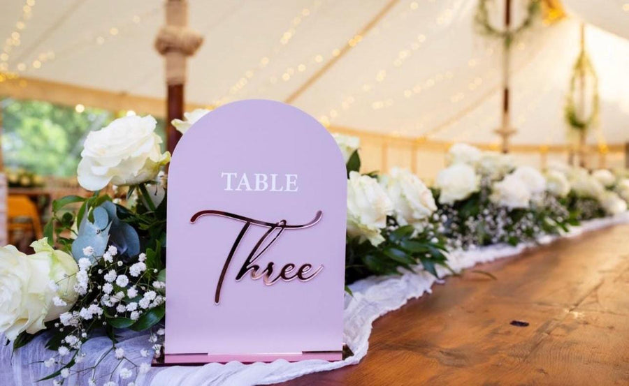 3D acrylic arched table numbers in clear, elegant design for weddings