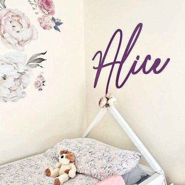 Personalised wooden name sign in light pastel colors for nursery decor