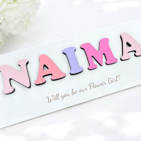 Personalised wooden name puzzle in pastel colors, ideal for toddler toys