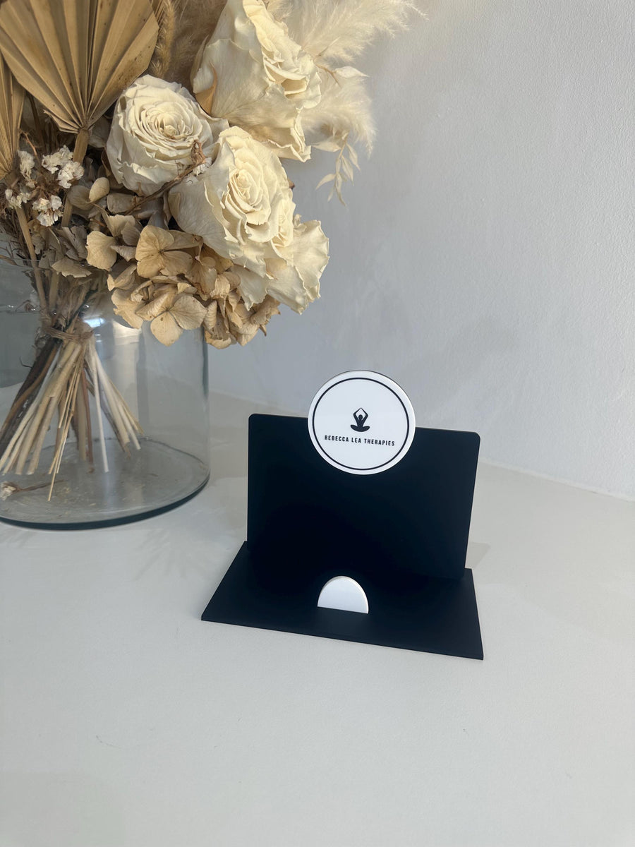 Clear acrylic business card holder with logo branding and sleek design