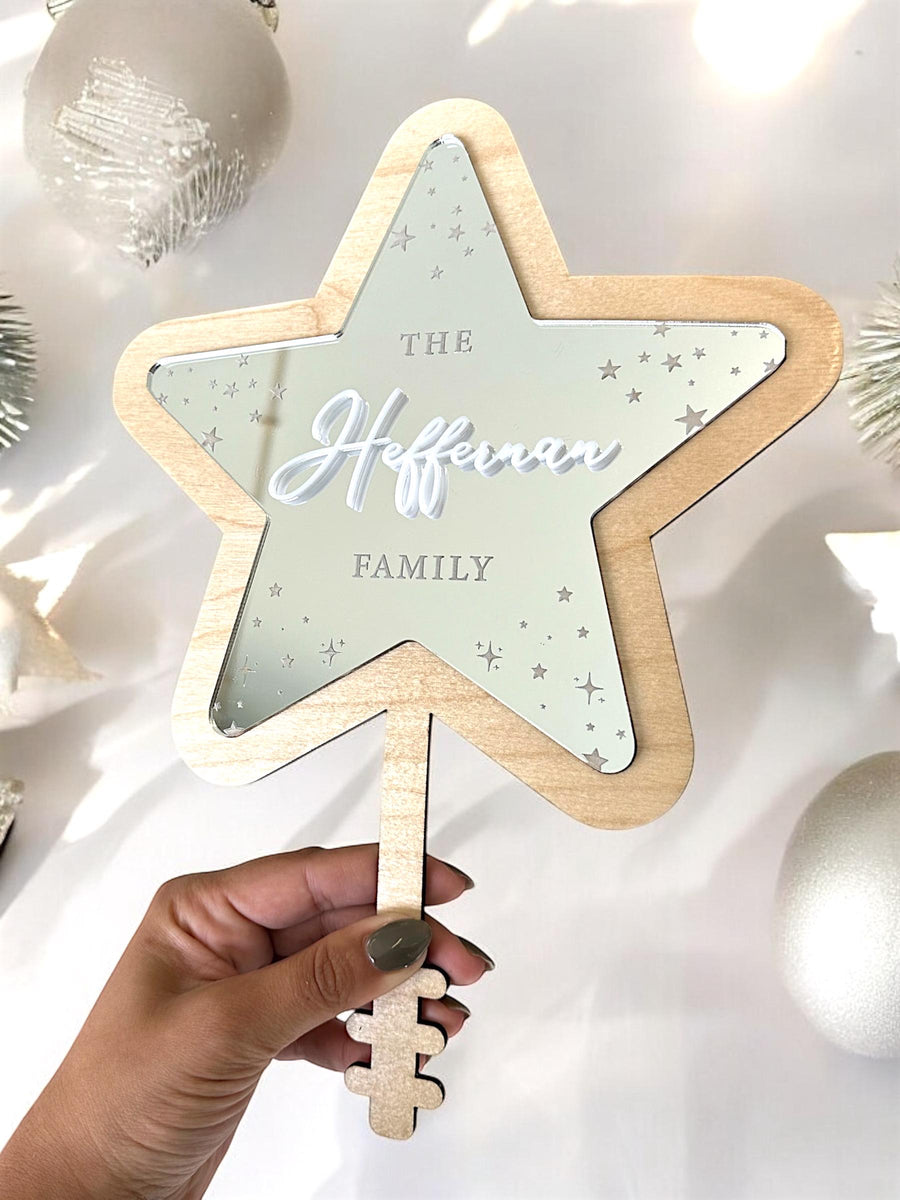 Personalised acrylic Christmas tree topper in star shape, custom family decoration