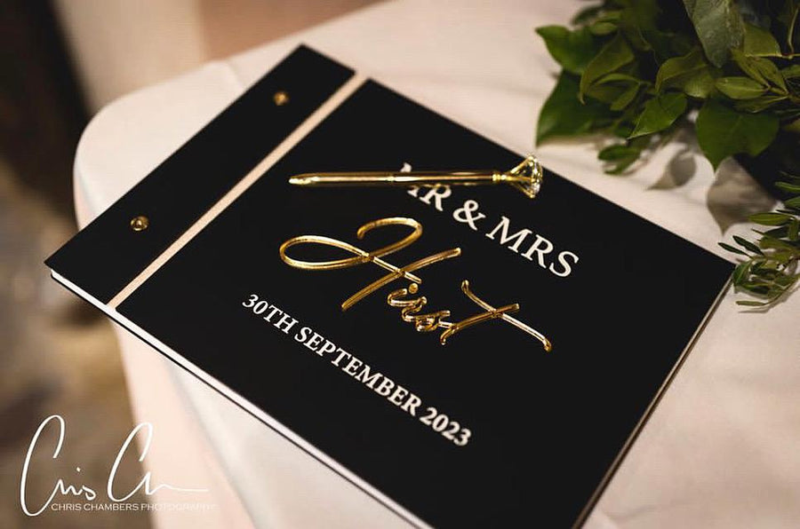 Custom acrylic wedding guestbook with a crystal pen, elegant design