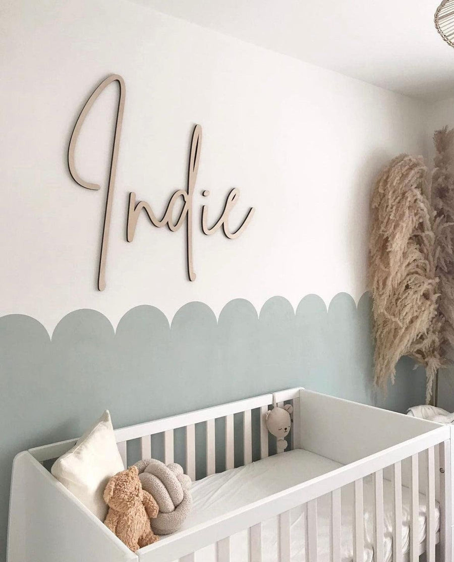 Custom nursery name sign in elegant wood, ideal for kids' room decor