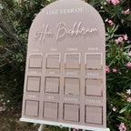 Personalised acrylic baby milestone board with custom design, ideal for first birthday decor.