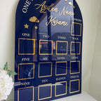Custom first birthday photo board with stars and clouds design.