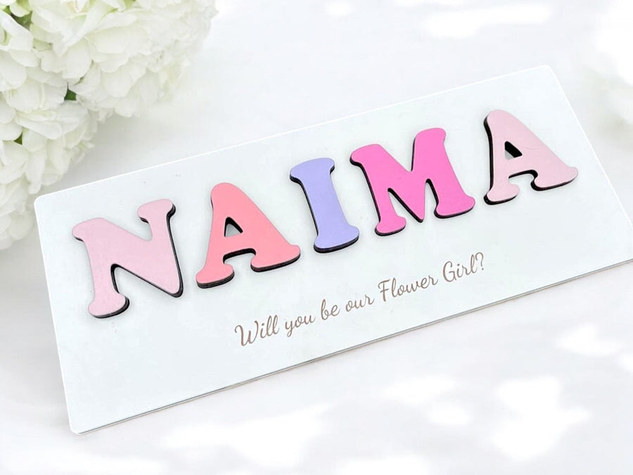 Personalised wooden name puzzle in pastel colors, ideal for toddler toys