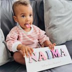Personalised wooden name puzzle in a colorful flower design for kids
