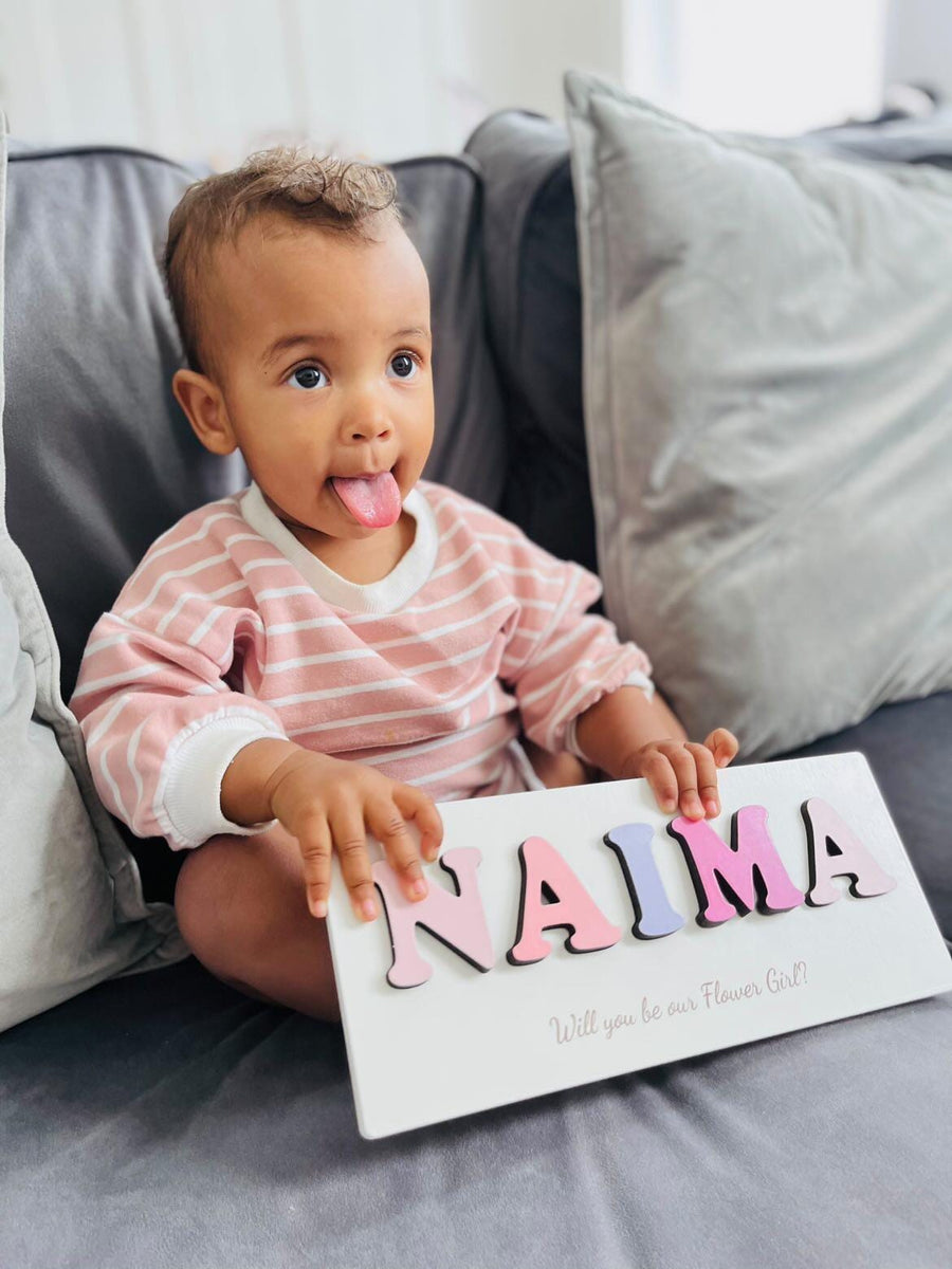 Personalised wooden name puzzle in a colorful flower design for kids