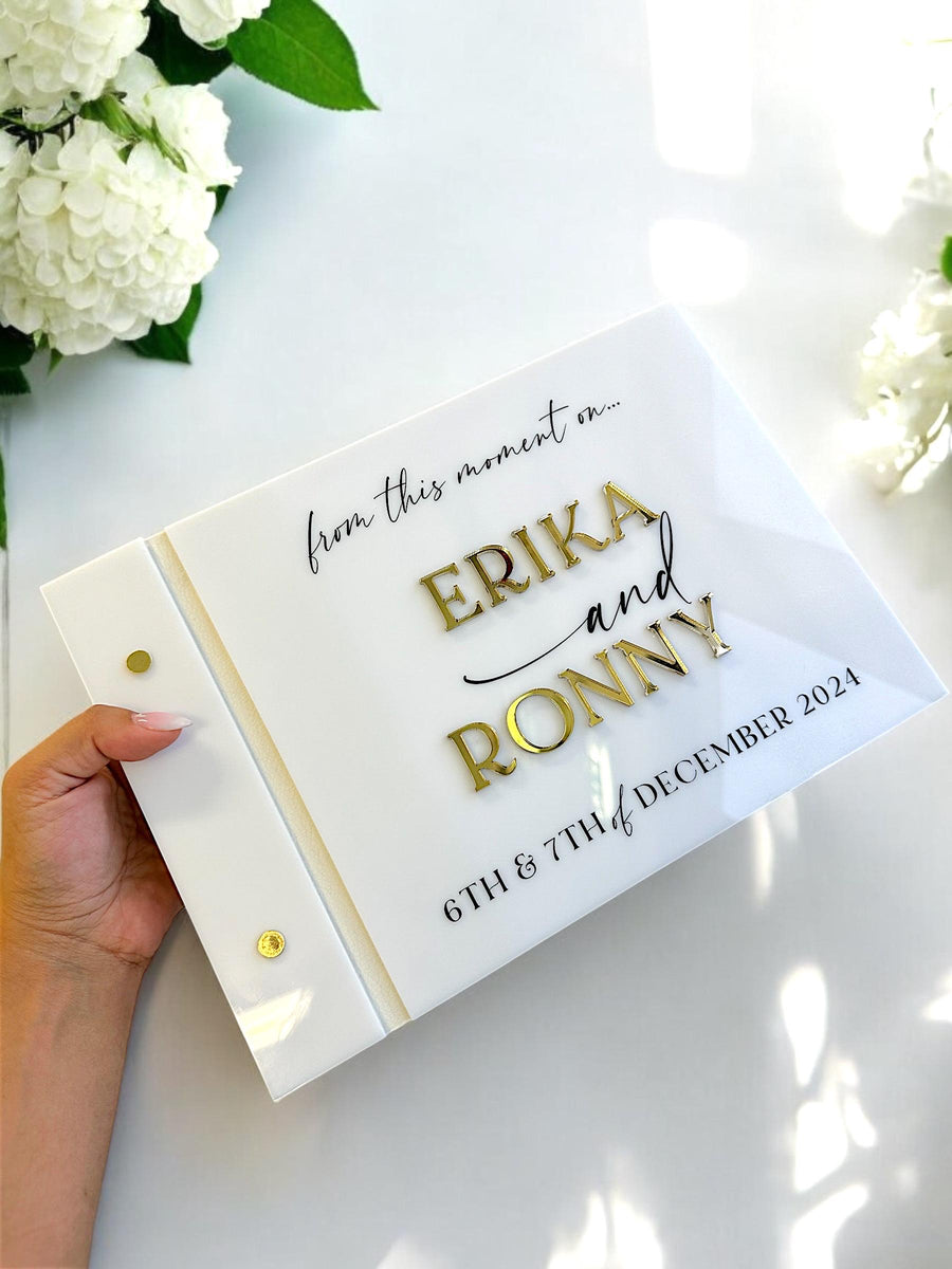 Personalised acrylic wedding guestbook with crystal pen, elegant design and clear material.