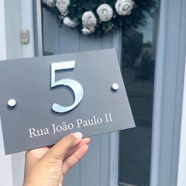 Custom acrylic house sign in clear, modern 3D design with stand-offs