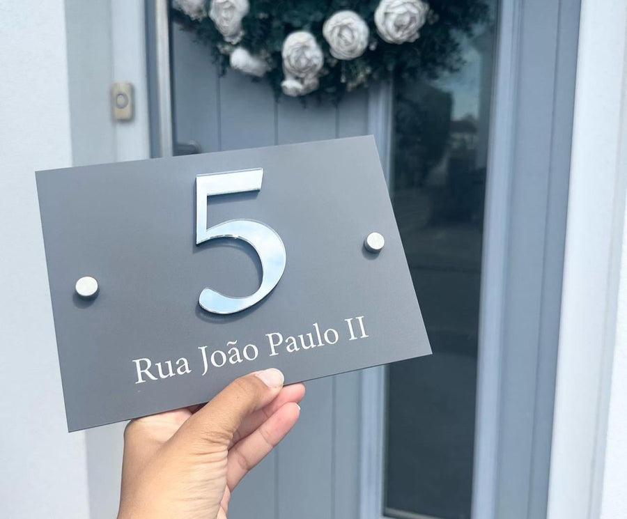 Custom acrylic house sign in clear, modern 3D design with stand-offs