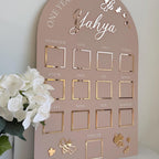 Custom first birthday photo board in bumblebee theme with milestone photos