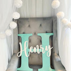 Custom initial and name wooden wall plaque in light wood for nursery