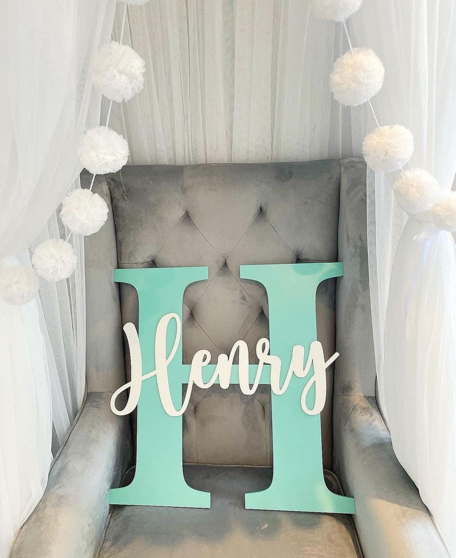 Custom initial and name wooden wall plaque in light wood for nursery