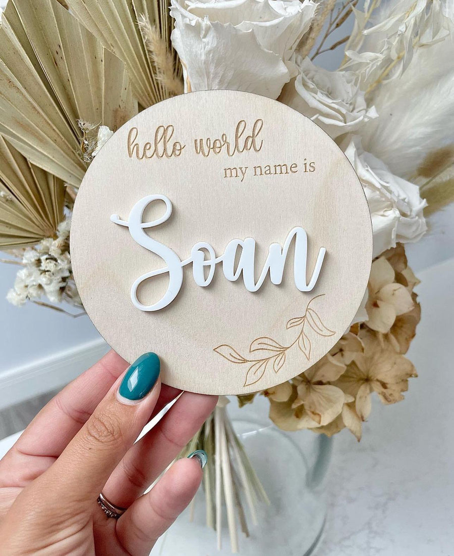 Personalised wooden birth announcement disc with custom name and 3D design