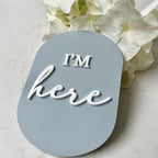 Acrylic I'm Here birth announcement disc in round shape, personalized baby keepsake