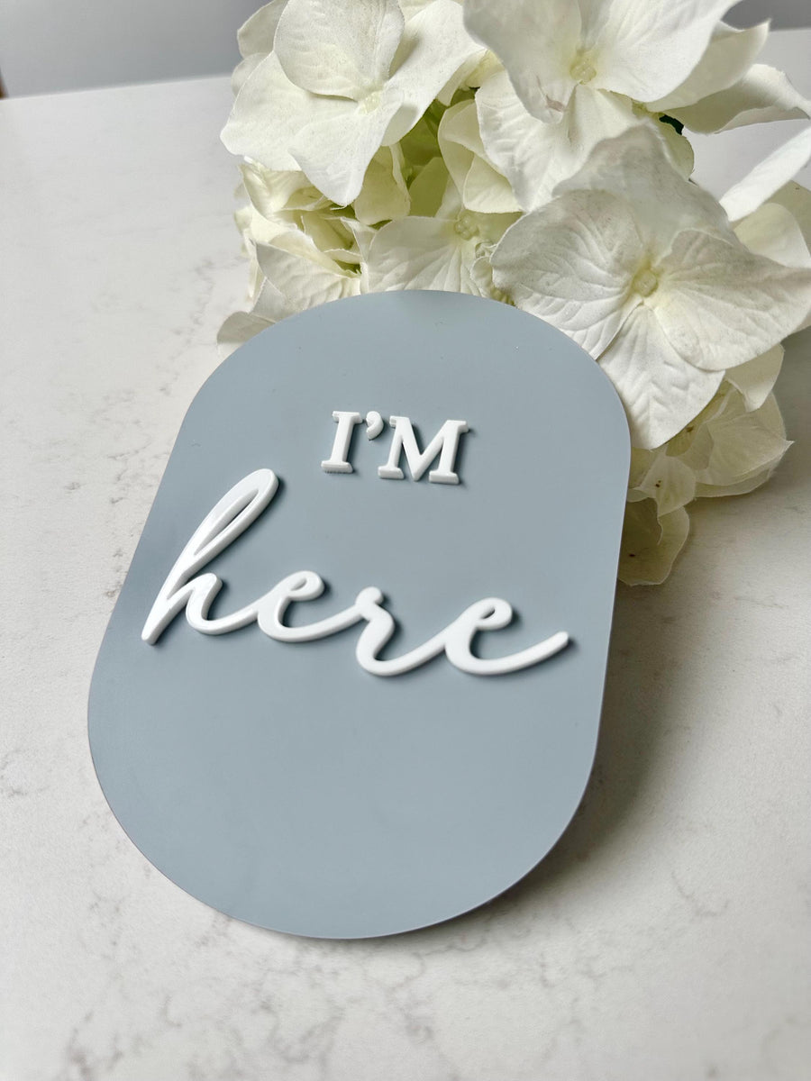 Acrylic I'm Here birth announcement disc in round shape, personalized baby keepsake