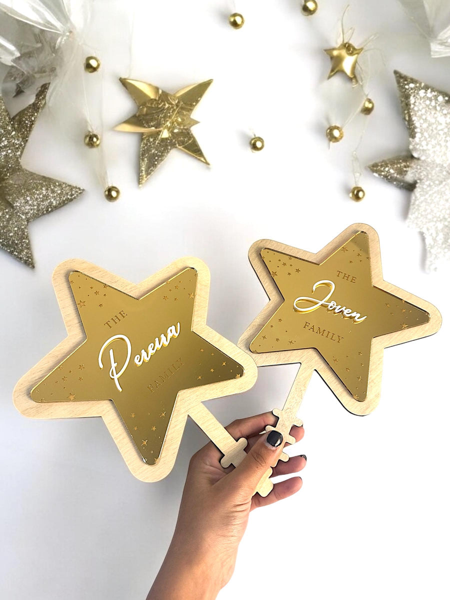 Personalized acrylic Christmas tree topper in star shape, family name design