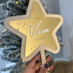 Personalised acrylic Christmas tree topper in star shape with custom name engraving