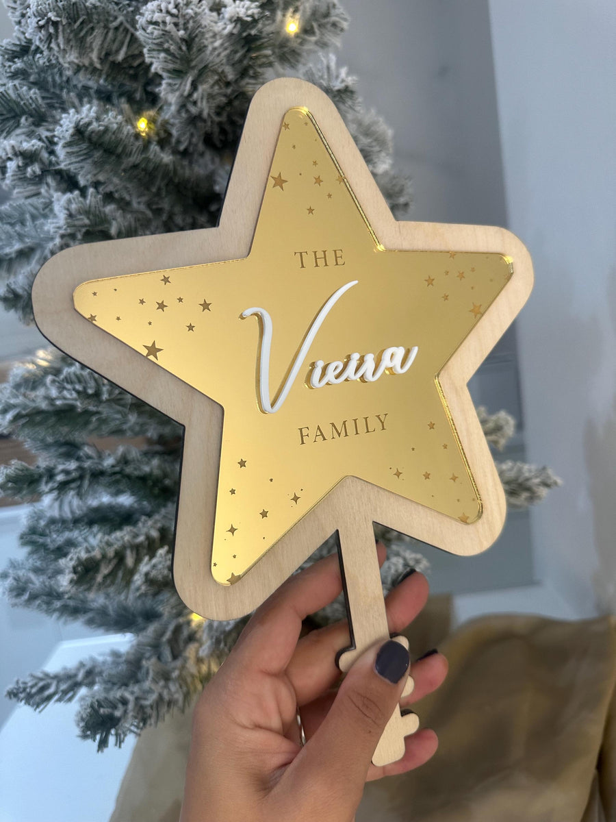 Personalised acrylic Christmas tree topper in star shape with custom name engraving