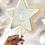 Personalised acrylic Christmas tree topper in star shape, custom family decoration