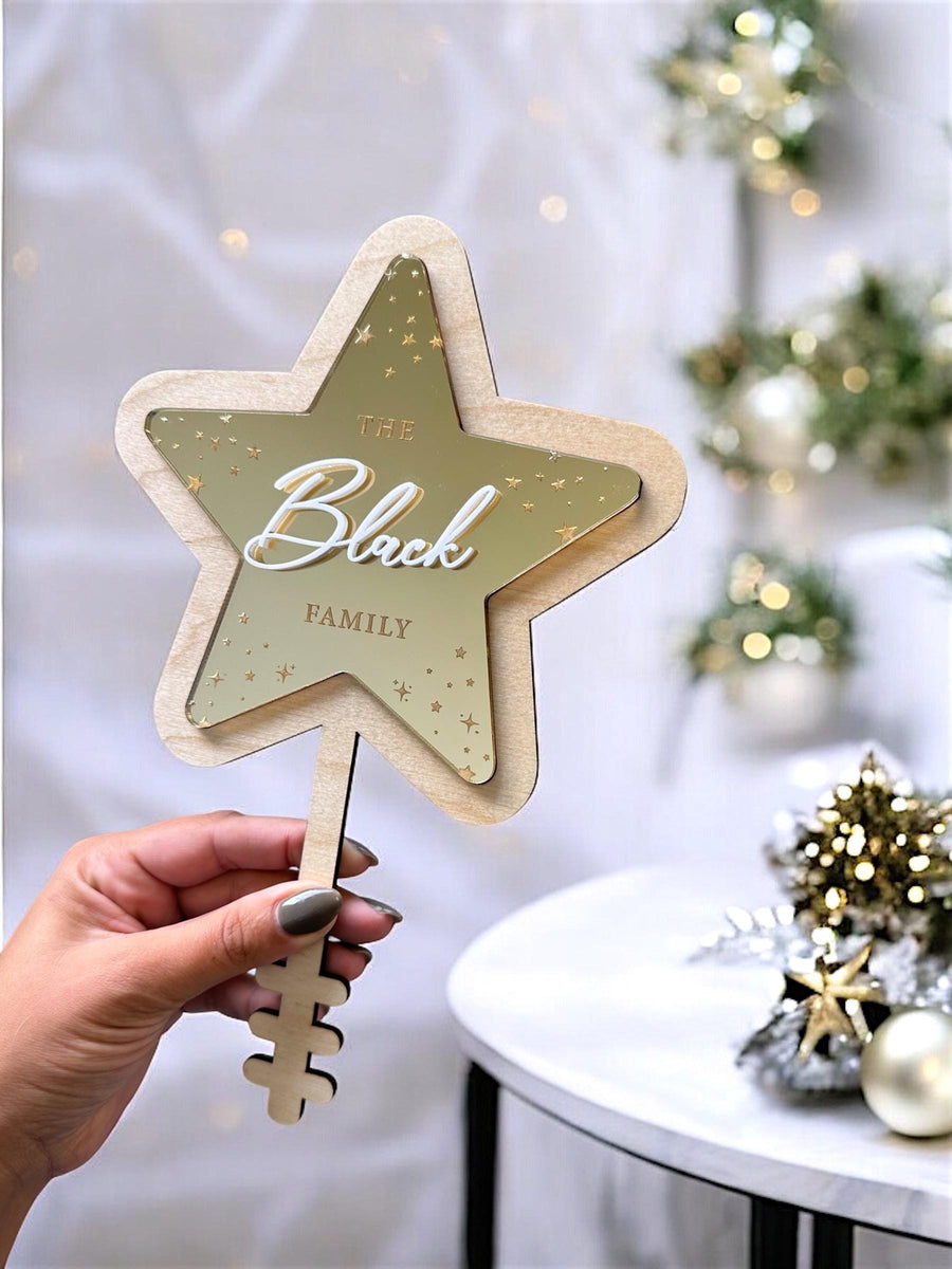 Personalised acrylic Christmas tree topper in star shape, custom family decoration