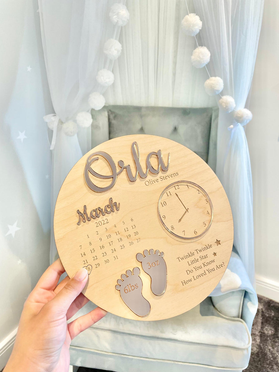 Custom baby keepsake plaque in light wood, showcasing birth announcement details.