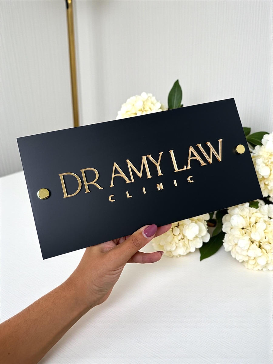 Minimalist business logo sign in black metal for reception decor