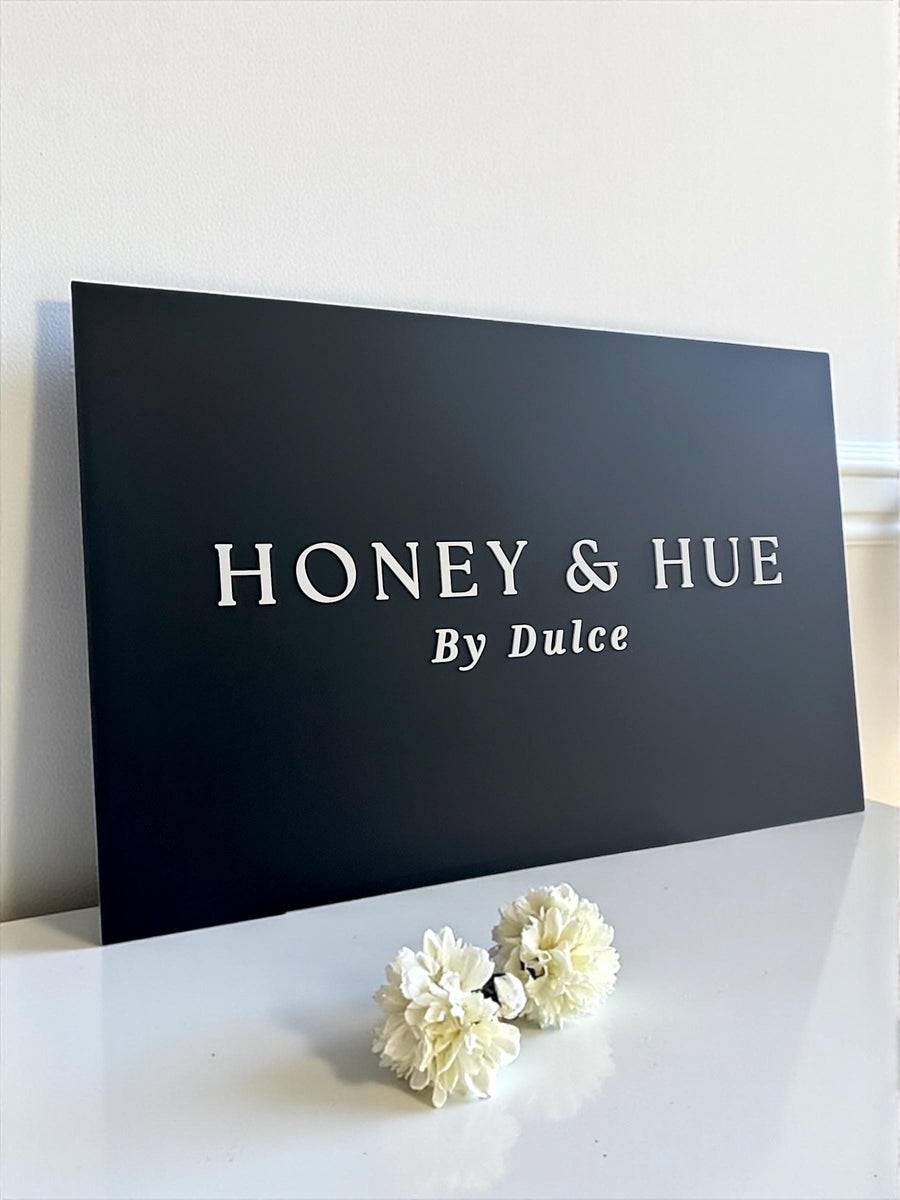 Luxury 3D acrylic logo signage in sleek black for modern salons