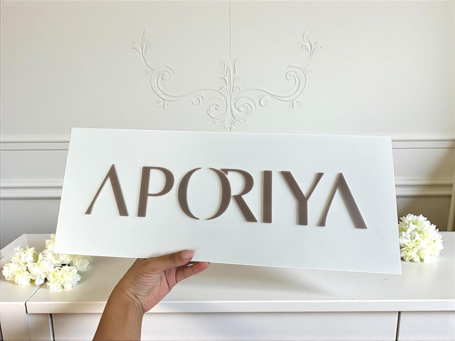 Custom acrylic logo wall decor for luxury dental office, modern design