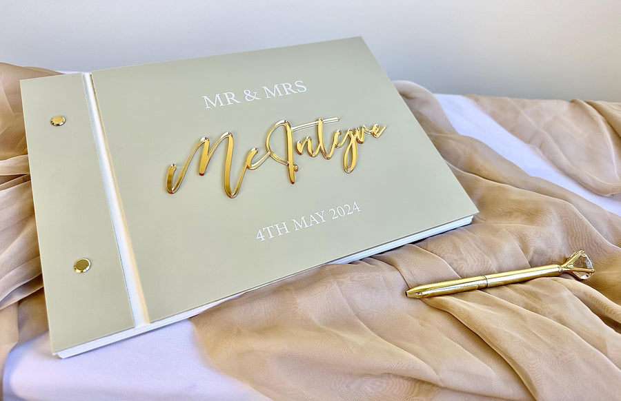 Personalised acrylic wedding guestbook with a crystal pen, elegant clear design
