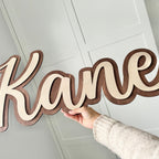 Double Layered Name Sign in elegant wood finish, perfect for home decor