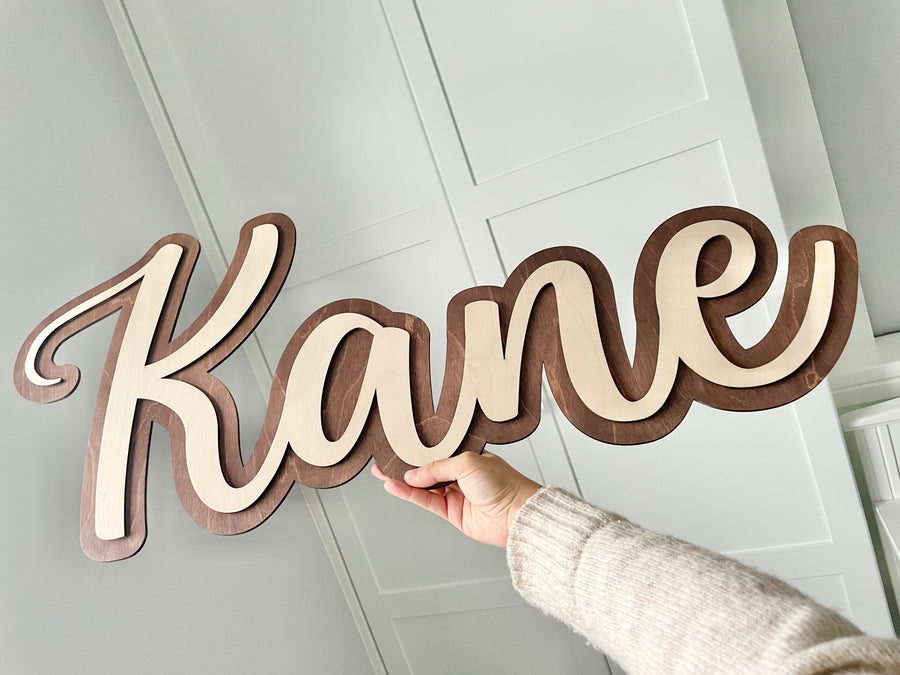 Double Layered Name Sign in elegant wood finish, perfect for home decor