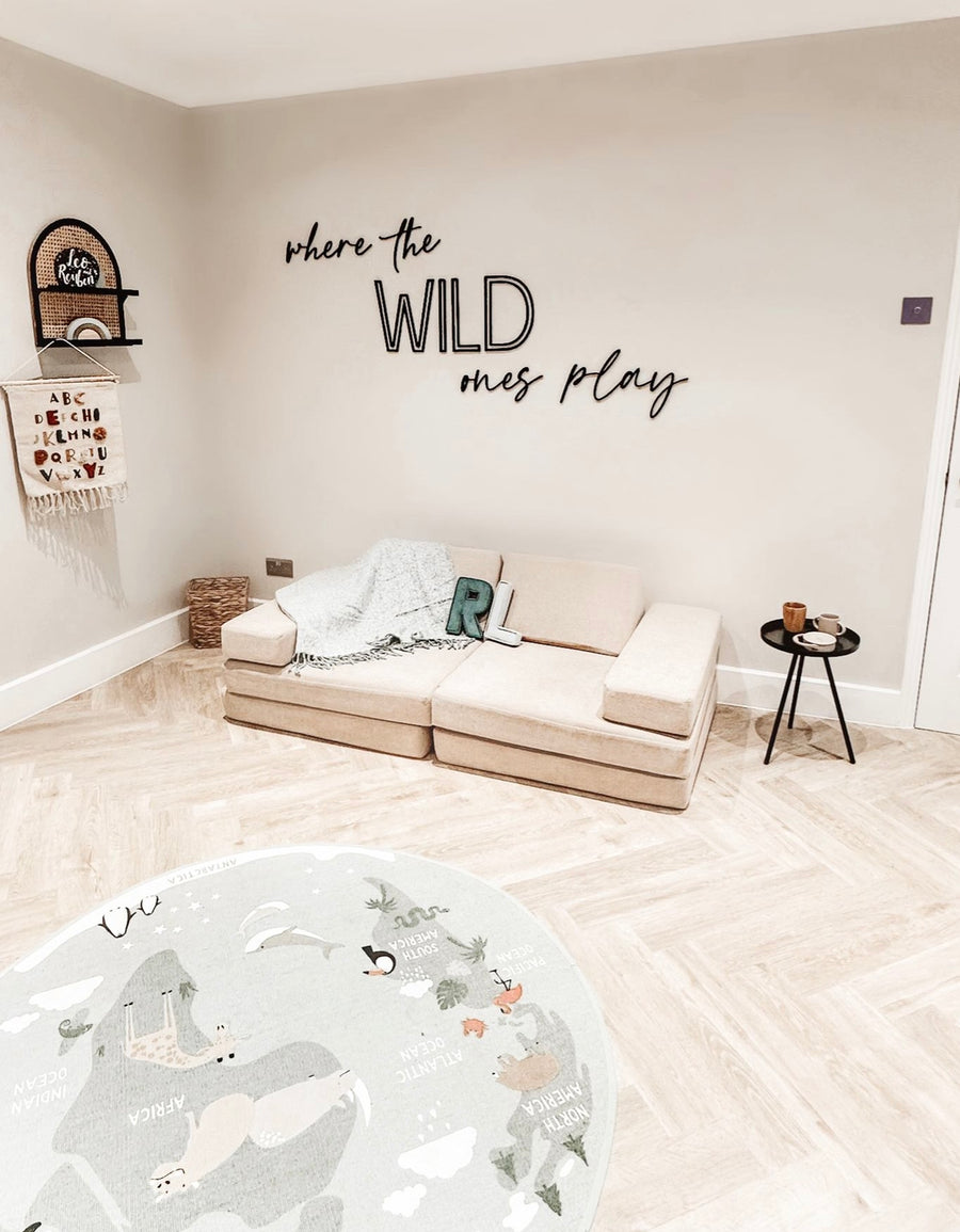 Wooden wall sign 'Where the WILD Ones Play' in dark brown color